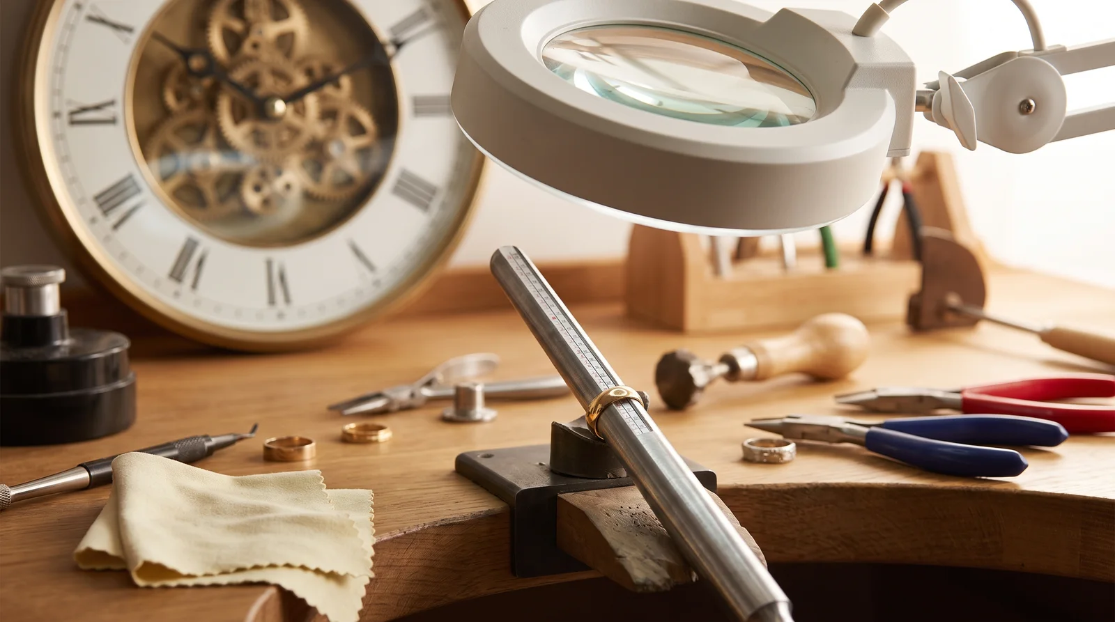 Jeweler resizing a gold ring, showing how much does it cost to resize a ring and turnaround time
