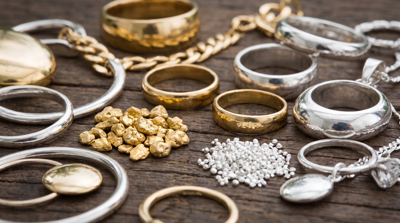 14K gold and sterling silver jewelry side by side, comparing shine and durability to answer is 14k gold good