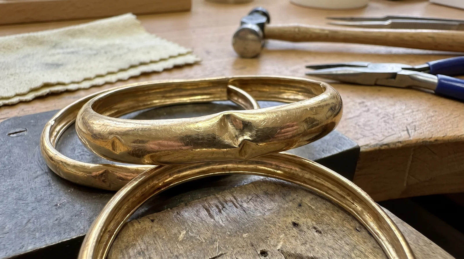 Dented hollow gold bangle showing surface damage, illustrating if a dented hollow gold bangle can be repaired