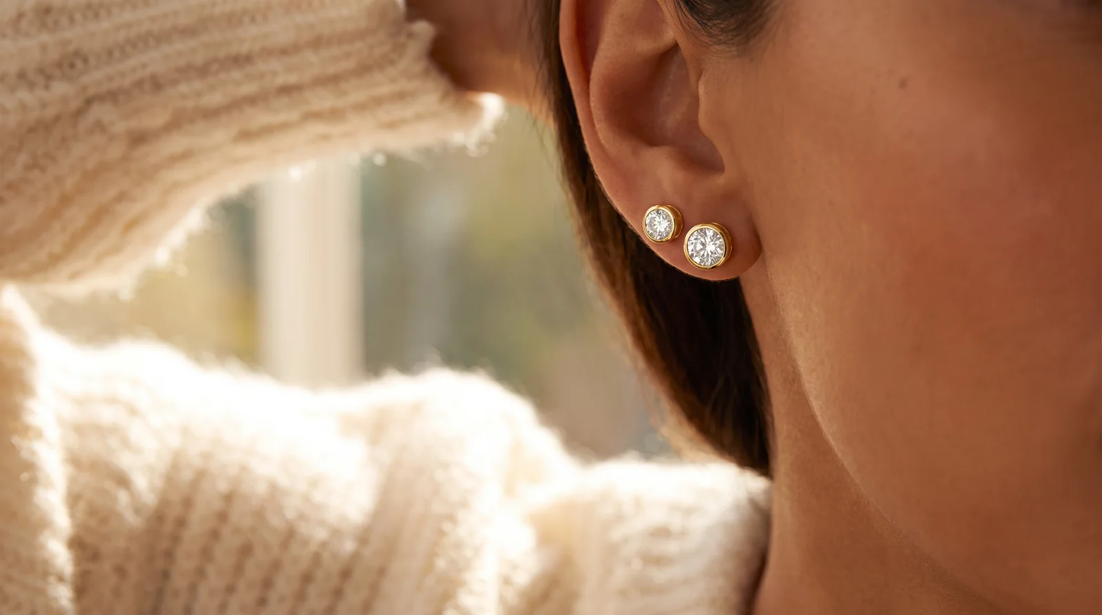 Yellow gold diamond stud earring showing natural luster without plating, demonstrating minimal maintenance needs