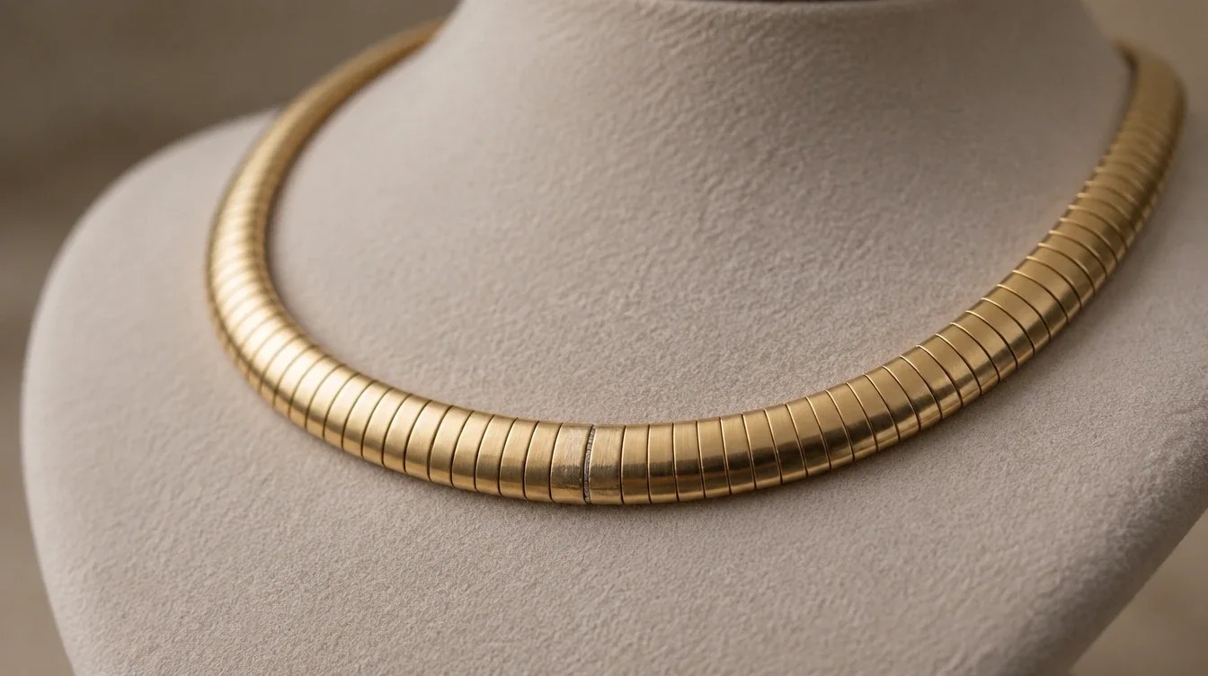 Illustrative omega necklace sample with a fine joining line visible across its front section